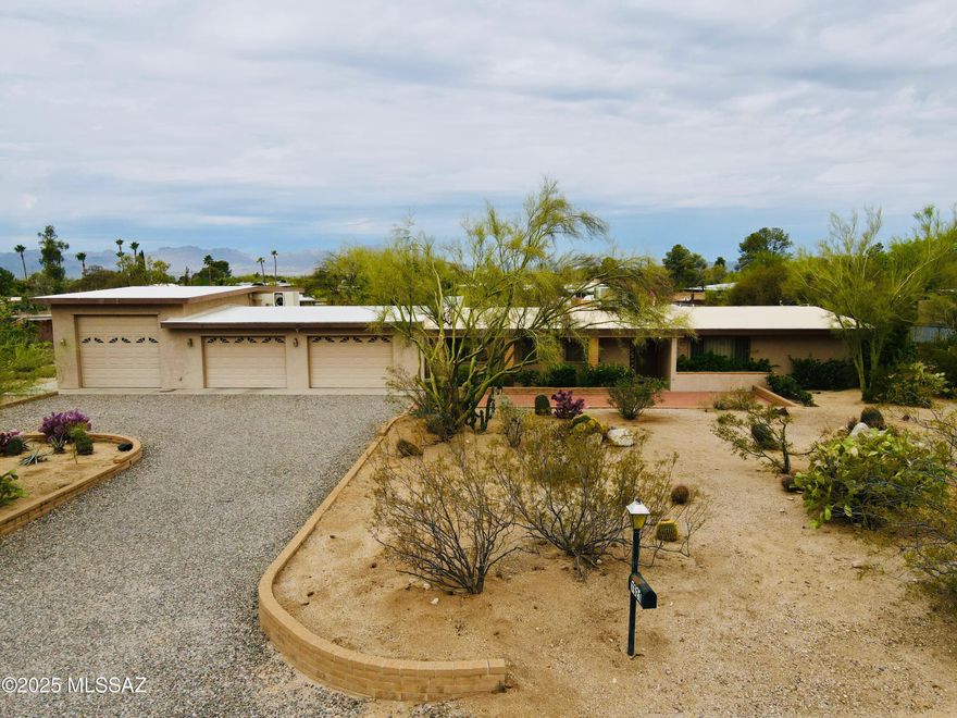 Beautiful North Tucson Home on Nearly an Acre with Stunning Views and No HOA—Ideal for Car Enthusiasts!

This charming 4-bedroom home in Casa Adobe West offers breathtaking Catalina Mountain views on a nearly one-acre lot—perfect for outdoor living, gardening, or expansion. Located in peaceful northwest Tucson, it provides privacy, versatility, and room to grow.

Built in 1983 and well-maintained, the home features a bright kitchen with bone color cabinets, granite countertops, and a skylight. The backyard boasts a Pebble Tec pool, extended covered patio, mature shade trees, and a natural grass area enclosed by brick walls—great for relaxation and entertaining.

The property includes a large, expanded garage capable of accommodating multiple vehicles, lifts (10ft door), and ample storage perfect for car enthusiasts. Without an HOA, you have the freedom to customize and expand as you wish.

Conveniently located near top schools, parks, shopping, and dining along Oracle Road, this property offers tranquility and easy access to Tucson's amenities. The spacious lot is ideal for outdoor projects, RV parking, or a workshop.

Don't miss this versatile, scenic property with incredible views and ample space schedule your private tour today!