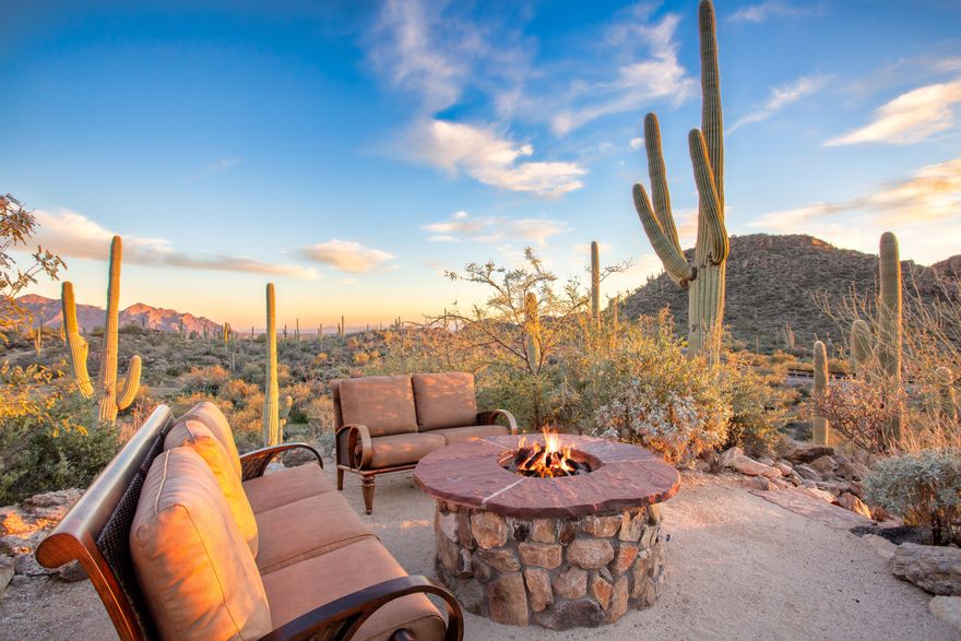 SAGUARO RANCH - A HOME FOR YOUR MOST DISCERNING BUYER. Custom Southwest Contemporary on more then 4 acres - designed by Mike Franks - captures the essence of an old ranch house while incorporating the best amenities available. Drive through a private tunnel to the manned gate. The kitchen is on par w/ the finest restaurants, featuring a Bertazzoni Italia range, Wolf warming ovens, Subzero refrigerators, 3 dishwashers & more. New tile wood flooring throughout, over 150k in new landscaping, lights, palms, citrus garden, pebble tec of pool & spa. More then 5,440 sq ft of Luxury w/ 3 beds & 4 baths. Master suite expanded to add a closet for ROYALTY, new Morning Kitchen w/ sink, dishwasher, & refrig, & beautiful doors opening to secluded patio w/ spa. Huge 3 car garage. SOLD W/ ALL FURNITURE.