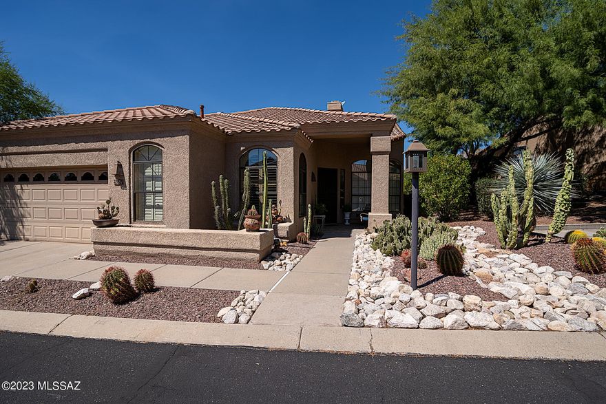 Updated to perfection & situated on the 11th Hole of the Mountain Course in popular Golf Villas of Ventana Canyon. Stunning interior design elements like Cantera Stone flooring, concrete surround fireplace, 42'' cabinets w/crown molding, tiled separate shower & private soaking tub in master, all blend together for a great designer feel. Cook's kitchen features double ovens, gas cook-top, tasteful granite counters, wine refrigerator & beautiful views from kitchen nook. More interior features include vaulted ceilings, formal dining area & wood flooring in executive office. Private back patio with stunning views & privacy. Two newer zoned HVAC's, newer water heater, Nest thermostats, this home has been meticulously maintained. Tasteful with a balance of classic ambiance, truly one of a kind.