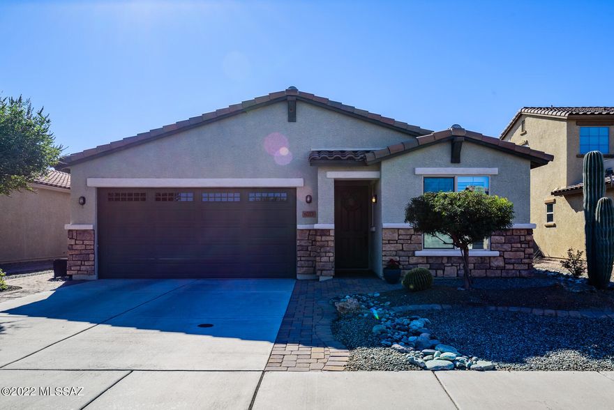 A MUST SEE!  This immaculate move-in ready Maracay home showcases pride of ownership. No need to wait for new when you can have it all at The Pines II prestigious gated community.  This gorgeous home includes:  a split floor plan; 3 bedrooms + den, high ceilings, upgraded cook's dream kitchen w/granite countertops, tile backsplash, SS appliances, and double oven.  Owner's suite is generous & has a new walk-in shower.  Extended glass doors lead to patio w/shades that provide outside space perfect for entertaining. The backyard is completely finished w/paved brick walkways & low care plantings. And talk about the views; Sombrero Peak, sunrise, sunset & mountains! Plus TEP Energy Efficiency & Solar offer significant savings on electric bills.