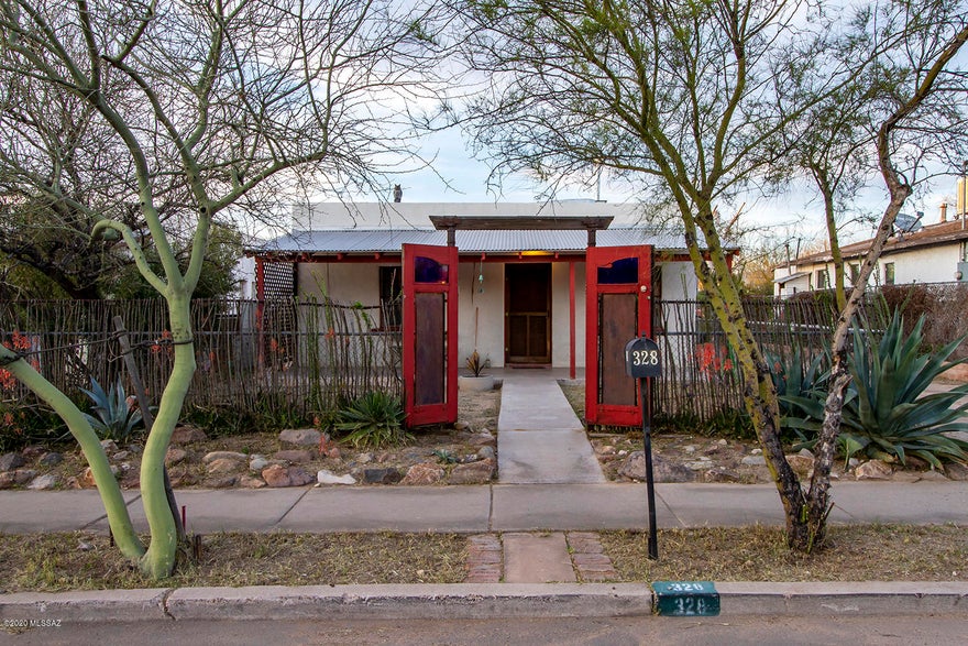 Affordable classic sonoran. Thick mud adobe walls, polished concrete floors. The open floor plan connects kitchen dining and living room. large backyard perfect for the urban farmer. Easy access to downtown Tucson, shopping and dinning.