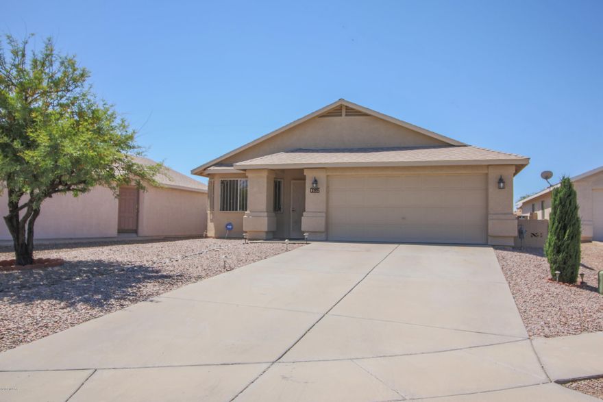 Immaculate 3 bd/2 ba home on a cul-de-sac just minutes away from the UofA, downtown and parks/recreation centers. The bright open feeling begins the moment you walk through the door into a massive great room w/ formal living area, vaulted ceilings and an abundance of natural light. Continue into kitchen w/ breakfast bar and versatile area that can be used as dining room or additional living area. Kitchen has tile countertops w/ decorative edges, updated cabinets with under-mount lighting and all appliances included. Bathrooms have been updated w/ new vanities with granite tops. Ceiling fans in every room. New roof installed 2018 and hot water heater is being replaced. Enjoy the beautiful backyard with covered patio and gated garden that has lemon tree, cantaloupes, grapes, and rosemary. Nice water feature provides soothing sound while watching the sunset light up the sky. No houses directly behind, don't miss this one!