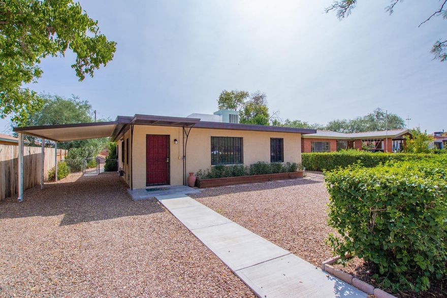 Solid brick home w/great curb appeal in the Historic District of Menlo Park. Central AC, neutral tiled floors throughout, lots of natural light, & retro kitchen w/modern touches. Plenty of painted gray cabinets w/hardware, breakfast bar, tiled backsplash, & unique, antique oven/stove to enjoy! Interior laundry room. New GFCIs outlets. Generously sized bedrooms, ample closets, ceiling fans, & 2 updated baths. Roof re-coated 2020. New home plumbing. Fantastic covered patio situated on a large lot w/a storage shed & room for your dream back yard. Stone table & benches. ROOM IN BACK TO BUILD GUEST HOUSE. Located near UofA & Pima College, Caterpillar & Amazon. Walk to Downtown, shopping, dining and Streetcar public transportation. Close to bike & walking trails, parks, & hiking.