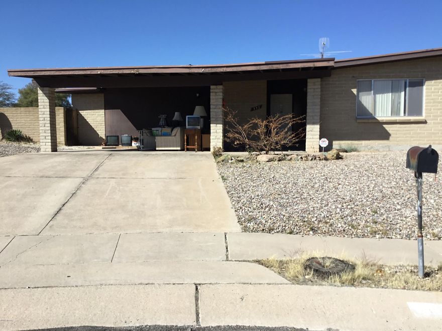 Excellent fix up opportunity. Solid brick home with pool in desirable neighborhood on a cul de sac. Walk to Saguaro High School. Great bones!!!