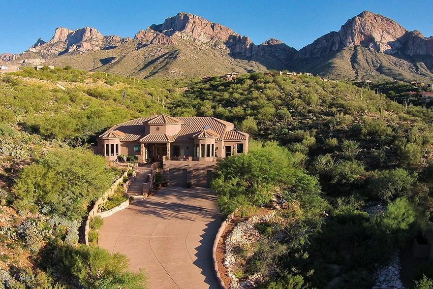Beautiful Custom home with Southwest Contemporary design located a 1.18ac private lot designed to capture majestic views from every room. Great Room is open to the Kitchen and Dining Area, w/floor to ceiling stacked stone gas fireplace and and a custom, glass block (lighted) seating/bar area. Two Master Bedrooms on main floor, plus two Guest Bedrooms and bath on lower level. SS Appliances incl a 2x tap beer refrig, Dacor Oven, Microwave, and 5 burner gas Cook Top w/Downdraft exhaust, Fisher Paykel double drawer dishwasher, KitchenAide 42'' built-in refrigerator-freezer, Trash Compactor, and Wine Cooler. 3 Zoned Trane HVAC, 75 gal Hot Water w/recirc system, and Water Softner. Dumbwaiter Lift from 3-Car garage to Main Floor. Walk-In Glass Block Shower and Jetted Tub in Main Master. Much More