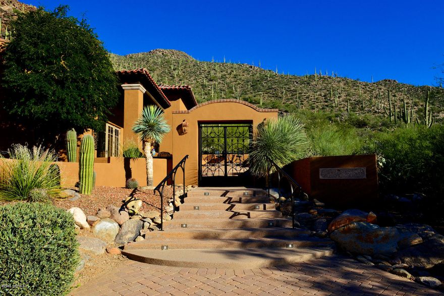 MAJOR $ REDUCTION! Stunning SW architecture with dramatic desert mountain setting, views & total privacy for the ultimate AZ lifestyle. Designed for easy living & featured on Tucson Home Magazine's cover, this custom masonry home incorporates upscale elements: Travertine, real wood floors, 6'wide halls, media wall w/hidden TV, game room, exercise room, steam shower, sauna, fountains & waterfalls, and dumb waiter from oversized finished 3-car garage. Quality masonry construction lends timelessness to a feeling of permanence and security synonymous with well-being. In guard-gated Canyon Pass w/in master-planned Dove Mtn (enjoy championship golf at Gallery Golf Club & 5 star Ritz Carlton). For the discerning Buyer who values privacy, amenities & style. Most Furnishings AvaiL, TRADE CONSIDERED