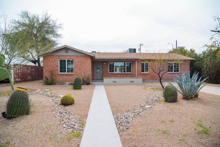 Just Like New in Poets Square, in the heart of Tucson with a detached Guest House. This HOME TOUR WINNER is a beautiful home that has been completely remodeled. Enjoy the charm of an older home with the features of a new home. You'll love entertaining in your amazing new kitchen or just relaxing in your spacious family room. It's also has a split bedroom plan, with a large Master Suite. You are minutes away from restaurants, parks shopping and Downtown/UofA area. It's ready for you to move in and enjoy!!