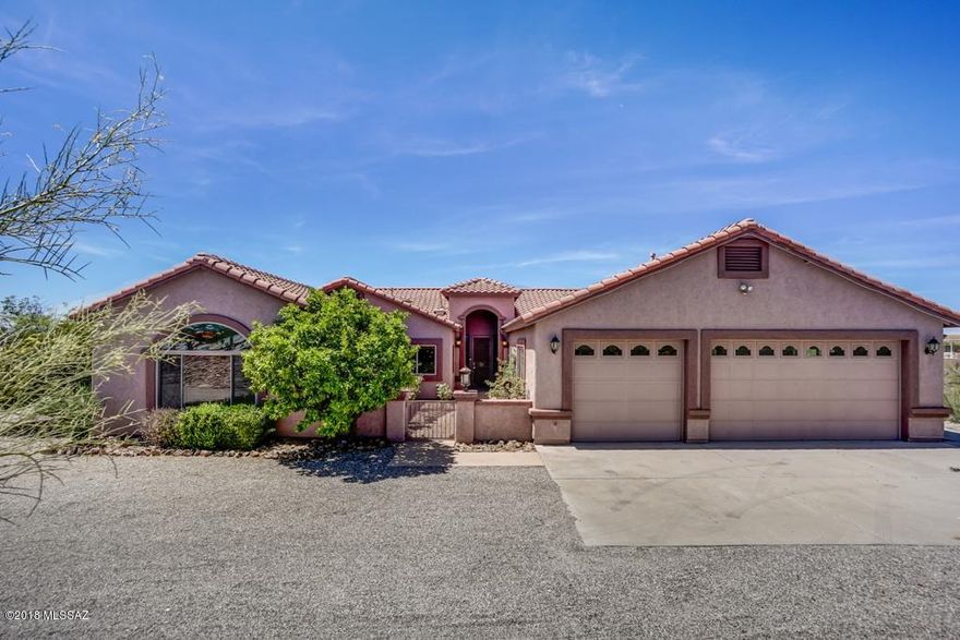 Gorgeous Custom Built 4 Bdrm/ 3.5 bath Home on acreage with Stunning Views. Huge Great room is perfect for formal dining & entertaining. Kitchen off family room has loads of cabinets, granite, Island, and breakfast bar. Ceiling fans, tile flooring, high ceilings throughout.3- bedrooms with full baths. Half bath off kitchen. Two master suites both with walk in closets, dual bath vanities, and spa tubs/separate shower. Enclosed heated and cooled Arizona room with closets. Washer/Dryer hook-up in laundry room with sink. Relax and enjoy the full length patio, low care backyard landscaping w/turf and open panoramic mountain views. 3-car garage. TUSD Schools. Solar home with electrical panel service, tenant will pay a flat rate of $150/mo. for electric. Refrig & BBQ as is. Lots of upgrades and r