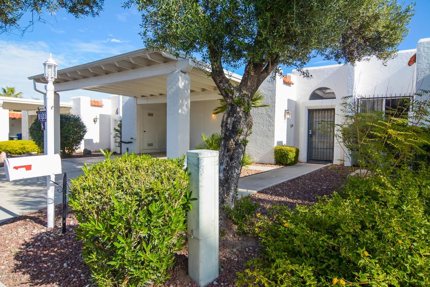 Beautifully remodeled Mediterranean Townhouse. Convenient Central Tucson Location. New rich laminate wood flooring. New modern kitchen with granite countertops and SS appliances. New earth tone interior paint. Upgraded carpet and padding in bedrooms. Dual closets in master bedroom. Light filled living areas. Large enclosed entryway. Covered back porch with mature vegetation. Updated light fixtures and hardware. Two car carport. Three exterior storage closets. Community features saltwater pool.