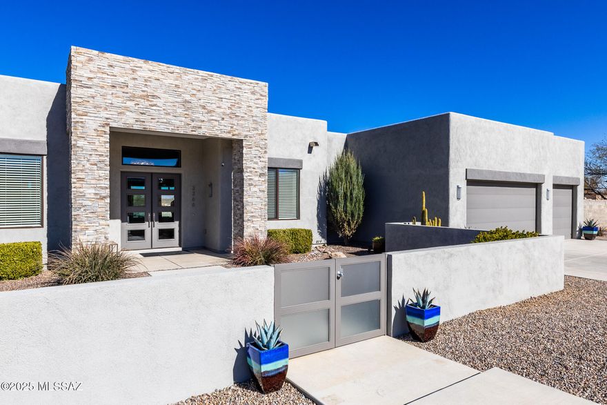 Escape to the luxury of this modern custom home on 3 private acres in the upscale Red Hawk at J-Six Ranch Subdivision 30 minutes east of Tucson & the Airport. Relax in the heated salt water pool, sit back in the 6 person spa, enjoy the sunset from the roof top deck or settle in and enjoy the view of the Rincon Mountains from the living room window wall with 12' ceilings.This one of a kind 3335 sf 3 bedroom 3 bath home has a designated office with built in desk system & Murphy Bed for extra guests & includes a fully enclosed heated & cooled AZ Room with 8' tall sliding glass doors that open to the back yard & pool area. There is an oversized 3 car garage w/ cabinets & a mini split + covered RV Parking with electric hookup. To top it all off this special home has an owned Solar System.