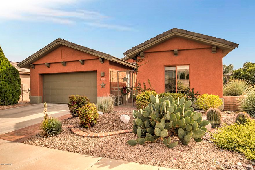 An attractive iron entrance gate and red brick walkway welcomes you into this beautiful home. Past the Standalone Casita, a lovely landscaped courtyard leads into the home, and Tile Flooring complements soft southwest color decor with stylish finishing touches. Tile counters and custom cherry cabinets/light fixtures can be found in the updated bathrooms and kitchen, which features SS appliances, a large pantry closet and lots of counter space. The great room with vaulted ceiling is spacious and adjoins a large dining area, and a Sliding Glass Door leads to the well landscaped back patio, which has nice mountain views. Custom, built-in cabinetry can be found in the Master BR, Den and Great Room, and the split floor plan plus the casita makes this home a welcoming oasis for family or guests.