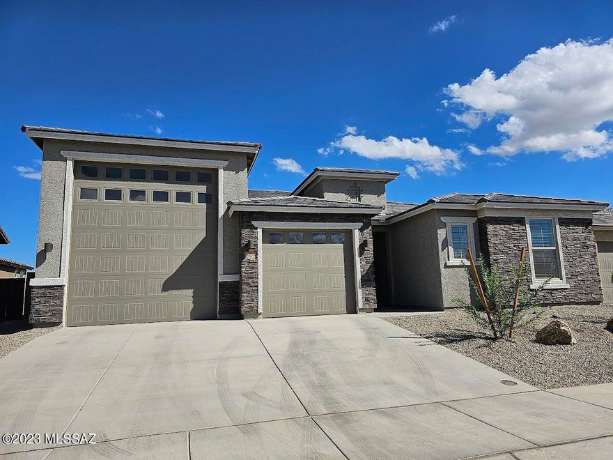 Home is SPECTACULARLY MAGNIFICENT! Never lived in! Includes so many things in addition to the oversized ultra RV garage on one side including a 14-50 outlet for your electric car charging station. Also includes: a 3-car tandem garage, utility sink, water softener, a garage service door. Gorgeous mountain views from backyard sporting view fencing to maximize your enjoyment and plumbed for gas grill.  Huge open great room, ceiling fans throughout. Great mud room with storage. Kitchen has massive island, walk-in pantry; double ovens; micro; gas, 5-burner range. Split 4 bedrooms from Master suite includes: oversized walk-in shower; huge walk-in closet; double sinks; door to the patio.  Laundry room with washer/dryer/utility sink and cabinets! Pets upon approval.