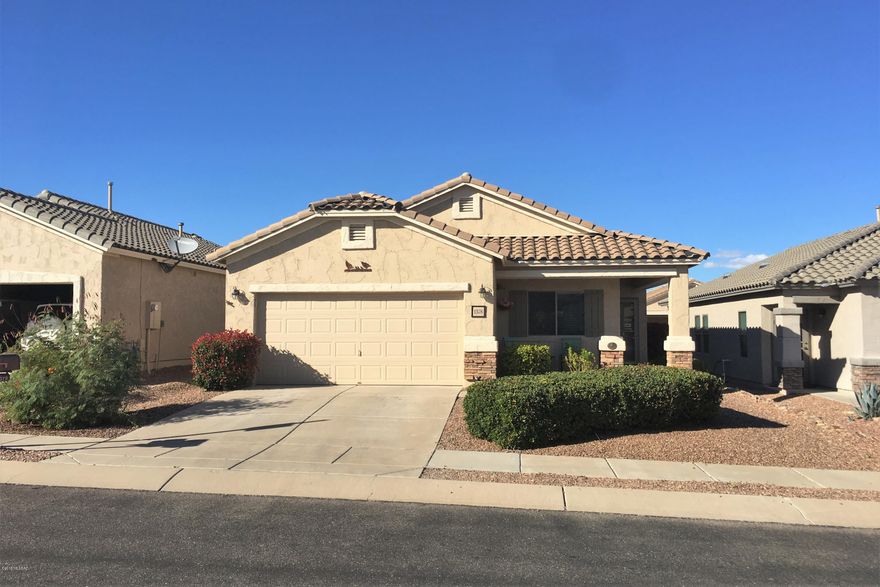 Beautiful and spacious home in the gated 55+ community of Rancho Resort. Step inside this airy home to a large great room perfect for entertaining with a formal dining area and spacious living room. The kitchen has corian counter tops, a nice island for food prep, and plenty of cupboards for storage. Upgraded tile and solid surface floors throughout the home makes upkeep a breeze.  The home offers a separate den/office space perfect for crafting or computer work. The large master bedroom is at the back of the house with a spacious walk-in closet and private bathroom. The master bath has dual sinks and a roomy walk-in shower. Outside you'll find a low maintenance back yard that offers a perfect sized out door space to enjoy the AZ weather.