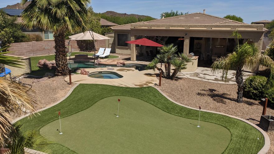 LEASE-BACK OPPORTUNITY ONLY.
Nestled into the base of Sombrero Peak, in the highly sought after gated community of Ironwood Reserve, this home is situated on an oversized lot w/ unobstructed views and is an entertainer's dream! The owner has not missed one single detail! Enter the front courtyard through a custom iron gate to find this amazing 5 BD/3BA home with a kitchen and oversized great room that is capped off with a 16' x 8' 4-panel telescoping door providing views to the backyard and beyond. The kitchen includes updated quartz countertops, huge island, gas range top with hood, glass tile backsplash, upgraded cabinets, and much more. The spacious master suite features a bay window, updated bathroom with soaker tub, walk-in shower with custom tile, dual custom vanities and oversized Split bedroom floorplan provides plenty of space with 4 additional bedrooms and bonus room. Home also includes 20x20 inch tile throughout the main areas and master bedroom, wood plantation shutters on every window, custom millwork and crown molding, can lights in every room, sunscreens, newly upgraded carpet in secondary rooms, surround sound, fireplace with granite hearth, LOTS of storage space... the list goes on and on. The spacious backyard is the epitome of outdoor living- featuring a sprawling 37x16' patio with industrial misting system, heated pebble-tec pool and built-in spa, grill area, putting green, fire pit, and an abundance of synthetic grass... you'll feel like you're on vacation every day of the year!