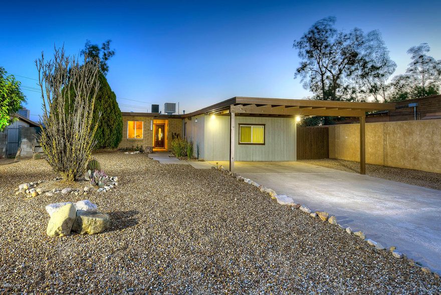 This beautiful Northwest home on nearly 1/3 acre features 2,015 SF of LIVING SPACE with 1,474 SF in the main home, plus a heated and cooled bonus room with a separate entrance. New interior paint, ceramic tile in main living areas and new wood-like flooring in bedrooms. Two skylights and French doors provide plenty of natural light throughout the home. HUGE back yard features city and mountain VIEWS, fruit-bearing trees, and an extraordinary covered patio, perfect for entertaining and enjoying the view. New roof coating in 2018, A/C, newer dual pane windows, and a hot water recirculator. Two-car carport plus long driveway will hold many vehicles. NO HOA! Lot is very private from neighbors and is located in a quiet cul-de-sac. DON'T MISS THIS SPECIAL HOME! See floor plan in Photos.