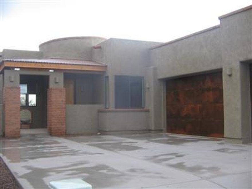 Beautiful views of the Catalinas and city lights from this upgraded home in gated Sky Ranch. Granite counters w/rollout shelving, 18 ceramic tile, pre-wire for surround sound, ceiling fans, fireplace