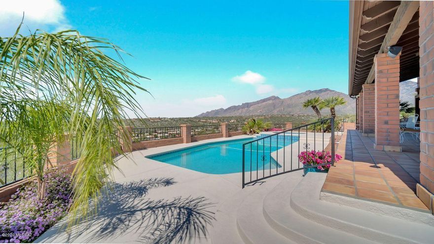 This stunning home offers the ultimate in Fairfield living, from the beautiful cathedral ceiling in the light & bright living room to the fabulous hillside pool with never ending Catalina mountain & city views! The popular 2BR+ den home is situated on an extremely private ¾ acre lot. When you enter the foyer, you experience a feeling of peace and calm as you look through the living room to the Tucson Valley. The rest of the house does not disappoint: the gorgeous master bathroom where you can enjoy mountain views and sunsets from your private spa; the updated guest bathroom; the unique granite and SS appliances in the kitchen leading to a charming covered patio. Located in a friendly neighborhood with a Jr. Olympic heated pool; spa & tennis. All lovely furnishings are available for sale!