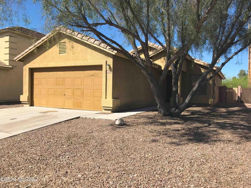 This cheerful & bright contemporary home features 3br/2ba, 2 living rooms, laundry room & a 2-car garage. Kitchen with Dishwasher, newer SS Range & newer SS fridge that opens into Dining Room that leads to the 2nd Living Room & access to covered patio w/ block fenced backyard. Freshly painted interior & Newer Carpet. Perfectly situated for quick & easy access to The LOOP (network of shared-use paths). Located on a Cul-de-sac. N/S orientation. Convenient to Downtown Tucson, Freeway, UofA, Pima College & Silverbell Golf Course. Renter's insurance required. Non smoking home. Max 2 small dogs. Requires owner approval & additional deposit/fees/rent. Sorry No cats.