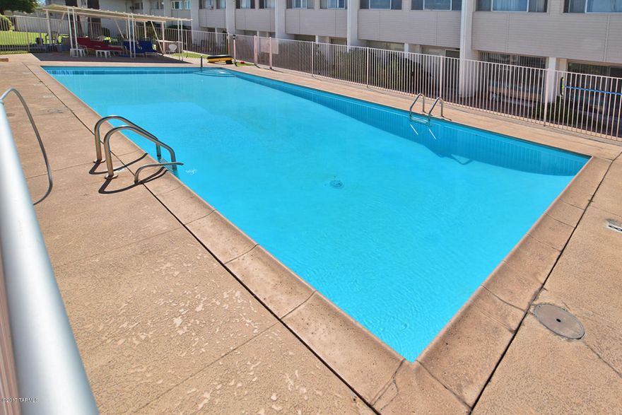 Rare Ground Floor Unit with enclosed patio for home office or library. Maintenance Free living HOA takes care of Water ,Insurance and most repairs.Close to Reid Park,Golf Zoo Shopping and much more.