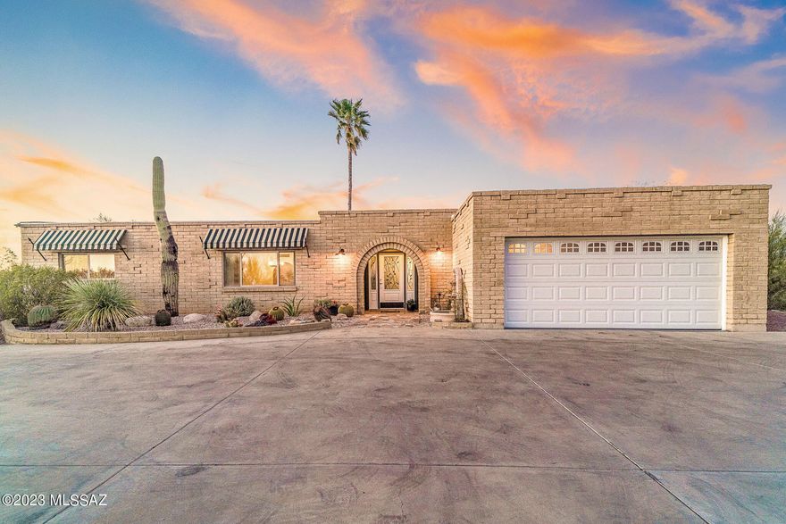 Stunning 360-degree mountain and city views abound from every angle of this hilltop Foothills home.  Exceptional privacy from a secluded cul-de-sac lot and unrivaled views set this home apart.  Every space has been thoughtfully planned out to capitalize on the tranquility wrapped around the home.  Climb up the custom designed spiral staircase to take full advantage of the dramatic mountain and city views from your rooftop deck.  Views of the Catalina, Rincon, Santa Rita, and Tucson Mountain Ranges in addition to downtown Tucson, U of A stadium, A Mountain.  Everything that makes Tucson unique and special surrounds you.  Enjoy the sunset and watch as the city lights twinkle to life.  Take a stroll down to your peaceful chiminea overlooking the wash for a smores party.  The sparkling pool and nearly new hot tub are perfectly located to maximize your enjoyment of the Catalina mountain views, creating a captivating oasis.  Grapefruit, plum, tangerine, pomegranate, peach and Cara Cara orange trees surround the meticulously maintained north-facing bacyard.  Step inside to discover a lovingly cared for home.  Large windows, skylights and sliding glass doors allow plenty of natural light throughout the home and allow the full benefit of the panoramic mountain views.  The kitchen is in the heart of the home and has been recently updated with granite countertops, pine cabinetry featuring large pull-out drawers. LG refrigerator and range, featuring "knock-on" technology, are brand new.  A perfectly placed full bathroom with custom stain-glass window off the family room allows visitors to the pool to step right inside from the pool patio to the bathroom.  The primary wing features a dreamy 450 square foot master bathroom.  Extra large soaking garden tub, huge steam shower, dual vanities, water closet with Kohler bidet and toilet.  A large window featuring Rincon and Catalina Mountain views and direct access to the spiral staircase leading to the rooftop deck are all highlights of this space.  HVAC with Air Ionizer, Water Heater, Roof, Pool Equipment and Pool Heater, Irrigation system all recently replaced.  Please see Features Sheet for a complete list of upgrades.  Low HOA, close proximity to 'The Loop', an interconnected system of more than 120 miles of paved pathways and bike lanes, and all of the shopping and dining you desire from your private oasis in the center of town.  Come see this one of a kind home today!