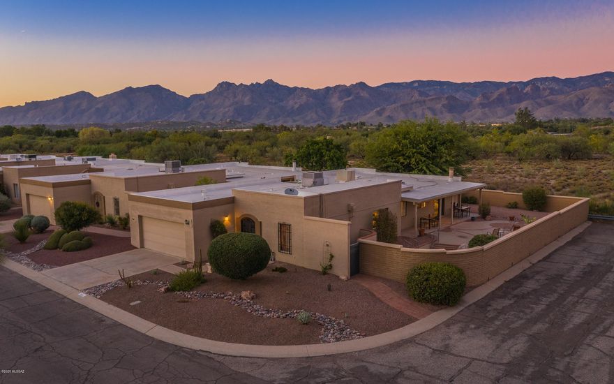 This AMAZING and ONE-OF-A-KIND home, located in desirable Fountain Park on a PREMIUM corner lot is waiting for You!  STUNNING MOUNTAIN VIEWS and great curb appeal.  Wonderful floorplan featuring  a spacious living/dining room and a delightful atrium. The updated and sensational chef's kitchen features tiled flooring, pendant lighting,  a corner gas fireplace and sitting area; top-of-the-line stainless steel appliances and an abundance of cabinets and countertop space. The updated owner's ensuite features dual vanities, a  large walk-in shower and a separate ''jacuzzi'' soaking tub plus two walk-in closets.  This is Arizona living at it's best with the full-length covered patio and sitting areas . Great spot for entertaining your family and friends. Community pool & park. COME TAKE A LOOK!