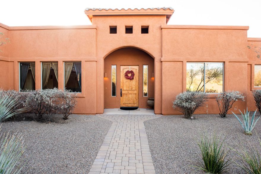Come enjoy the natural beauty of the Rincon Valley! A place where wildlife and privacy abound in this gorgeous nearly 3,800 square foot custom home with breathtaking city and mountain views in sought after Coyote Creek. The property features a stunning gourmet kitchen with granite counters, slate backsplash, GE monogram appliances, large owner's suite and huge 8 car, 1705 square foot garage!  Oh the possibilities for a car lover! Inside you'll find 3 bedrooms, 4 bathrooms, den, plus an additional den/excercise room in the owner's suite! The home sits on a scenic 2.2 acre lot that backs to a wide wash where the javalina, deer, quail, and coyote's roam. Just up the street is the private equestrian facility with access to the soft rolling and flowing hills of the Arizona Trail. For the sports lover there's numerous courts, including full court basketball, 2 pickle ball, 1 tennis, and sand volleyball as well. All are within the gated confines of this luxury community too. Don't wait a little slice of heaven awaits in Coyote Creek!