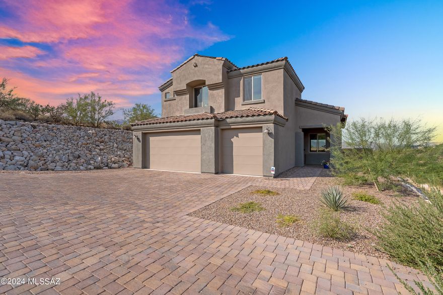 Enjoy a luxe desert lifestyle in this sleek, contemporary home built in 2023 by award winning A.F. Sterling Homes. Stunning mountain & sunset views. Unique opportunity to own a new home in the Catalina Foothills on nearly an acre of land with no HOA fees and District 16 schools! This elegant 3 or 4 bedroom, 2 ½ bath home has an open living concept w/ high ceilings & beautiful natural light. The main living/dining area opens to a covered entertaining patio & views of Tucson Mountains & sparkling city lights. Extra 1st floor room can be 4th bedroom, den, office or exercise room. Upgrades include an electric vehicle charging port, modern kitchen with large island, primary bedroom w/ private sunset balcony, gorgeous bathroom & large walk-in closet, brick-paved driveway, (more... water filtration, alarm system & 3-car garage! Close to UA, downtown, the Loop, & Tucson's best shops & dining.