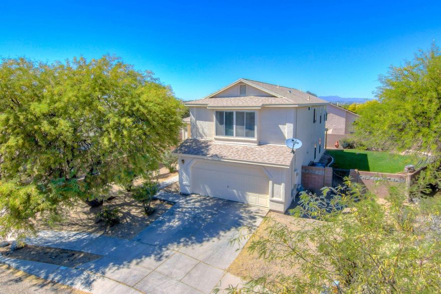 Great West side location tucked in a cul-de-sac in a tidy neighborhood! Two story home on a pool sized lot. New carpet throughout.  Light and bright floorplan with four bedrooms upstairs, half bath downstairs.  Easy care yards provide ample space for entertaining and separate dog run area on West side of house. Quick access to I-10, Pima and U of A, shopping and entertainment and hospital. Hurry on this one!