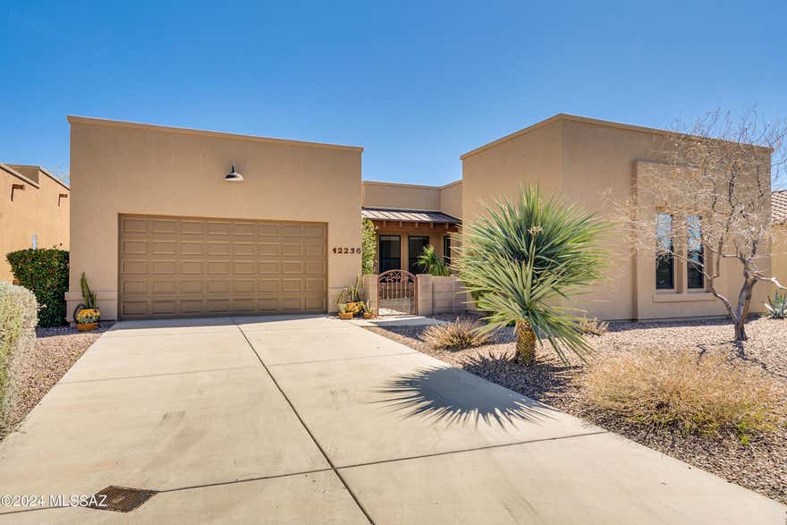 Rare find for this 4 bed/4 bath with den, exquisite home in desirable Dove Mountain Preserve! Elegant, spacious floor plan, great room concept, formal dining room, 2800 sq. ft. Beautiful courtyard entrance, custom paint & neutral palette, tile flooring-carpet in bedrooms, upgraded lighting/ceiling fans throughout. Chef's delight w/gourmet kitchen, cherry cabinets,  stainless appliances, wine fridge & red wine storage, double ovens, breakfast bar, granite counter tops- perfect for entertaining! Generous dual Primary bedroom suites with walk in closets, each with private bathrooms. covered patio, water fountain, outdoor bar & bbq, view fence with breathtaking views that open to the preserve. Central Vacuum, 8 ft. doors, water recirculation, reverse osmosis and the list goes on.