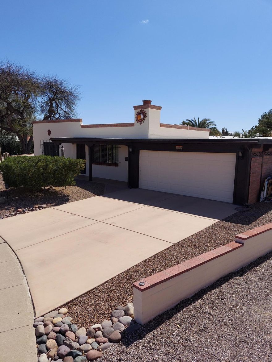 Very Quiet cul-de-sac with mountain view. 
Big Savings! No GVR. 
A full wall was removed to reward the chef with bright open veiws through both the front room and sunroom windows, creating delightful open spaces. 
Kitchen has been redesigned specifically for the Joy and Efficiency of Cooking! Fresh and light artist created kitchen countertops.  
Large multiuse area includes office, exercise space, shop & laundry w/ commercial stainless tub. PLUS the storage area you've always dreamed of! This is a well maintained bright, charming home with many extras including HOME  WARRANTY. Granite with raised sink bowls in both baths.  Stargazing window seats in Sunroom in addition to a long screened-in porch. Skylights, Plantation shutters. New paint & tile. And the most desirable 2 Car GARAGE!  N
