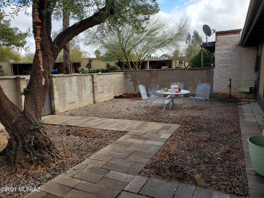 Great Location.  2 Bedroom / 2 Bath with a 2- Car Carport, an enclosed patio and fenced in yard.