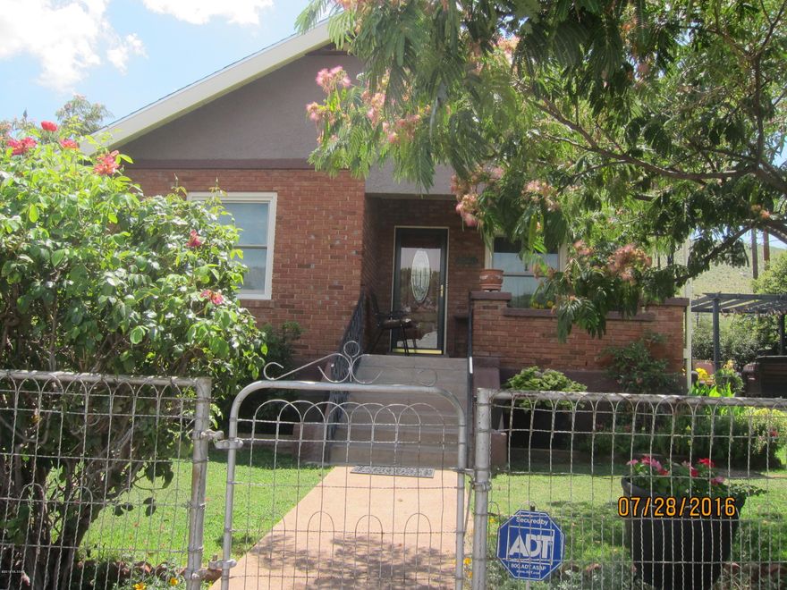Upgraded and well maintained Bisbee home with newly refinished Hard Wood Floors, Air Conditioning, Vintage 1942 Metal Cabinets, Anderson Windows, Crown Molding, ADT Security System and 30 YR Architectural Shingled Roof with enameled fascia (2006).  Beautiful landscaping and privacy.  Nice patio for relaxing and bricked side yard for easy maintenance. Corner lot in nice quiet neighborhood.
