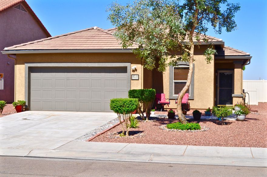 Thinking about a new build option? Think again! Meticulously maintained turn key home by Pulte in Red Rock Village.  Enjoy views of Picacho Peak from your beautifully landscaped backyard.  Perfect for entertaining! This 4 bedroom 2 bathroom home features an open concept floor plan, large eat-in kitchen with elegant cherry cabinets & stainless steel appliances, custom built-in laundry area includes front loading W/D, and separate Master suite.  Neighborhood amenities include 2 parks and a community center with private pool & water slides.  Call today for showing!