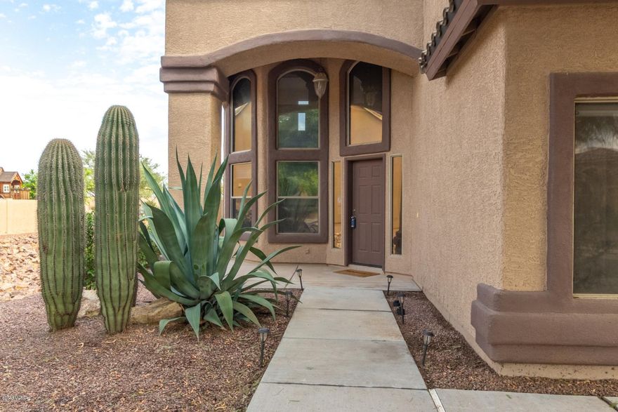 Gorgeous 5 bedroom home available in coveted Rancho Sahuarita. Love life in this amazing lake community while enjoying amenities including a pool, spa, tennis, parks, clubhouse, splash pad and more. Interior features include elegant formal living and dining rooms, a separate family room, a den, loft, dramatic vaulted ceilings, plant shelving, pristine tile, warm custom paint tones, and walls of windows for soft natural light throughout. Designed for entertaining, the open concept kitchen is sure to impress with ss appliances, sleek countertops, stylish backsplash, a breakfast bar and a sunny bay window dining nook. Huge upstairs master with private ensuite. Inviting backyard with a covered patio and no rear neighbors for optimal privacy. This gem is everything you are looking for!