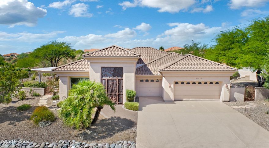 Upgraded Cheyenne with Owned Solar on 1.03 Acre Lot. Great Curb Appeal & Custom Entry Gate. Foyer leads to Den/Office off Living & Dining Area with slider to Patio with Pergola. Wet Bar to entertain & Family Room has wall of windows with Slider to Patio. Kitchen has Granite Counters, Black & Stainless Steel Appliances, Gas Cooktop, custom Backsplash, Dining Area & Desk. Owner's Suite has Bathroom Suite with Walk-in Shower, Soaking Tub & 2 Walk-in Closets. Guest Wing has 2 Bedrooms with closets & Bathroom nearby. Laundry Room has W/D & storage. 3 Car Garage has Utility Sink, newer HVAC's & W/H. Interior freshly painted & tile flooring thru-out. Outdoor Oasis has Covered Paver Patio, extended Pergolas, Built-In BBQ, Fruit Trees, & Raised Garden Bed. Lovely Landscaping & Gated Yard to enjoy!