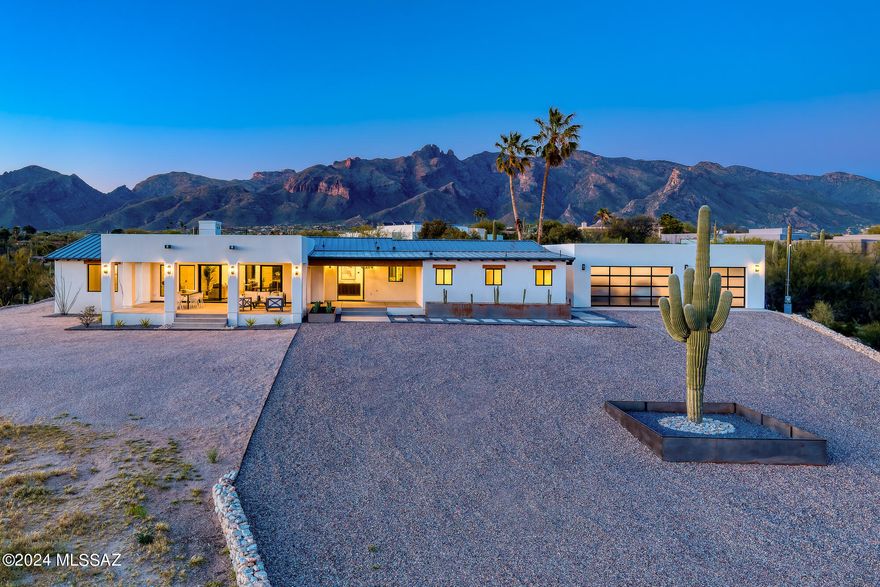 COMPLETELY remodeled & expanded on a fabulous 2.41 acre serene view lot TUCKED FAR BACK & AWAY-NOT ON CAMPBELL! The orig architectural design elements have been honored via lightly whitewashed exposed brick walls, dramatic wood beams, & a reimagined mid-century design fp. Engineered wood floors, stunning lighting, & modern finishes seamlessly blend the old w/ the new in a casually elegant open plan. A show-stopping kitchen is anchored by a vast quartz countertop island w/bar seating & new gleaming SS appliances. All new primary suite that will WOW you w/beamed ceiling & a magnificent spa-like  bath. Main living spaces boast view-framing glass slider doors; massive outdoor living/dining room, artificial turf, contemporary planters a< brand new 3-car garage AND a pet shower station NO HOA!