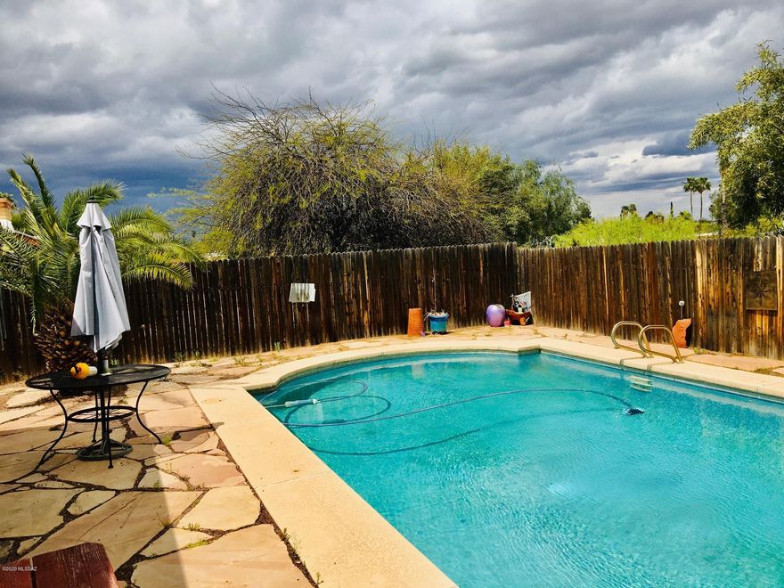 Owner has taken very good care of this FOUR BEDROOM home. Kitchen has nice appliances  and white cupboarding with stainless hardware, Corian countertops, double sink and window. Tons of storage. Dining area with wood burning fireplace. Large living space with huge open window and wood flooring. Four bedrooms with two updated bathrooms. Covered back patio AND gazebo, Large fenced (plastered) Pool with all accessories. Outside storage and so many more things to see.
Inquire about warranties.