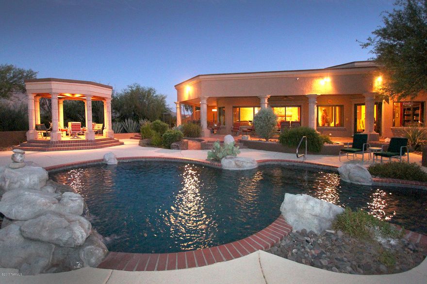 Motivated Seller! Summerlands Estate becomes available! This resort-style paradise on 6.6 acres resides on the east side. Expanded and renovated in 2004, this home shows all the meticulous details that makes this truly a one of a kind home. Hand-forged iron work, murals, canterra stone, granite, marble, hand cut stone, etc. Lush garden and natural foliage and unique artwork and sculptures that add to the resort feeling. Both residences have pools and hot tubs, horse stables and kennels. Guesthouse garage also has steel T-support truss for an engine hoist and 2 car lift stack rack allowing 8 car parking. Endless panoramic mountain views and access to miles of riding trails. Plenty of room for a sports or tennis court. This is truly a spectacular and uncompromising estate!