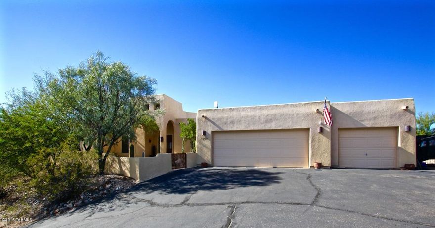 Hilltop treasure located in gated community.Winding drive to courtyard entry.City lights & mountain views. Tile thru-out home Great room design with custom f/p,sitting area,soaring ceilings.Kitchen boasts granite tile, SS appliances,5 burner cooktop,built in oven large pantry, 42'' decorative cabinets,tiled backsplash & breakfast bar.Large dining area.Private office with glass double doors.Master suite with double walk-in closets. Master bath complete with dual sinks, stone shower with glass block, jetted tub. Split floor plan with oversized secondary bdrms.Backyard boasts,synthetic grass area, view fence, flagstone 2 covd patios & built in spa. Beautiful desert landscape. 3 car garage with storage, central vac. Laundry room complete with cabinets.  This home is immaculate and move-in read