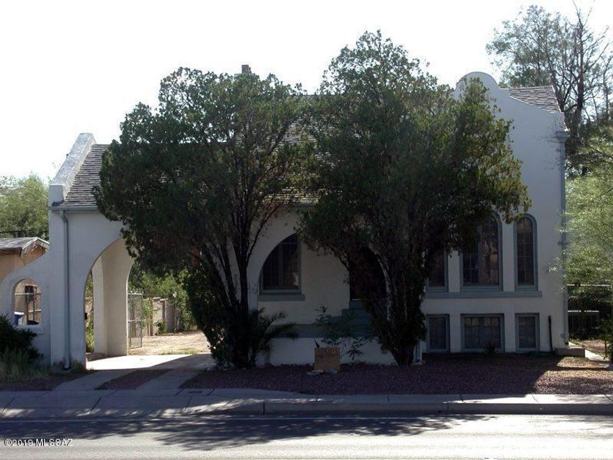 4 Bedroom 2 Full Bath Beautiful Vintage 1925 Historic Home, lovingly maintained.
Three-story Vintage 1925 historic home. Original hardwood floor in living, library/study, and dining rooms. Cozy living room with original wood burning fireplace. Separate dining. Separate library/study room with beautiful arched deco windows. Adorable kitchen with Sahuaro rib cabinet & saltillo tile floor.

Bathroom and laundry room on the main floor. Three bedrooms
downstairs and one large cozy bedroom upstairs. Gigantic yard with private access gate. One and a half block from U of A. Near shopping & transportation. Bus stop right in front of the house.