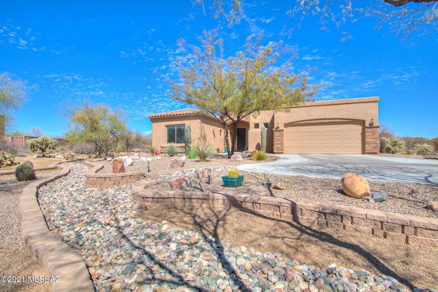 This is a ''MUST SEE'' luxury AF Sterling semi-custom home in the quiet Tortolita Vistas gated community which boast a pristine move in ready, split floor plan, low maintenance house with amazing extras and upgrades inside and out. You'll love the wonderful view of the mountains thru the wall of windows in this magnificent Atrium/Sun Room addition which has soaring ceilings, 4 skylights, porcelain wood plank floor and a HVAC/Heating Split System for your comfort year round. When you are to ready to cook you'll appreciate the large custom gourmet kitchen with upgraded higher grade quality granite countertops, deco glass backsplash, 5 burner gas on glass cooktop, built in electric over, under cabinet lighting, expresso stained oak cabinets, 42'' uppers, and lots of deep drawers.