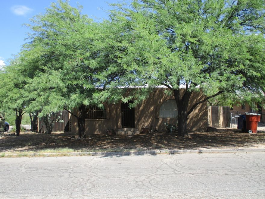 Charming older home on a large corner lot.  Brand new carpet living, family, hallway, and both bedrooms. Covered locked front patio, eat in kitchen, Large enclosed backyard, storage shed, and mature shade trees.  Laundry room has hook ups,