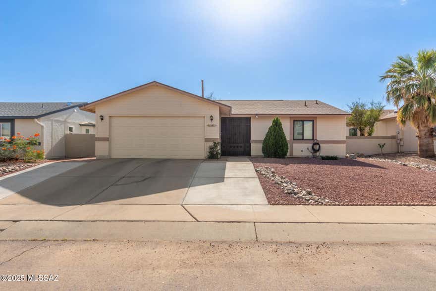 This well-cared-for 2-bedroom home offers comfort, style, and functionality. A 2-car garage, low-maintenance front yard, and secure wrought iron entry create a welcoming first impression. Inside, vaulted ceilings and wood-look flooring enhance the spacious living area, while double French doors provide a seamless connection to the backyard. perfect for relaxing or entertaining. The updated kitchen features granite countertops, white shaker cabinetry, a tile backsplash, stainless steel appliances, and a convenient pantry. The primary bedroom includes a private bath with dual sinks and plenty of storage. Step outside to enjoy the full-length covered patio, extended paver area, peaceful water feature, and a storage shed all set in a beautifully landscaped backyard. A great opportunity to own a move-in-ready home with tasteful finishes and indoor-outdoor living.