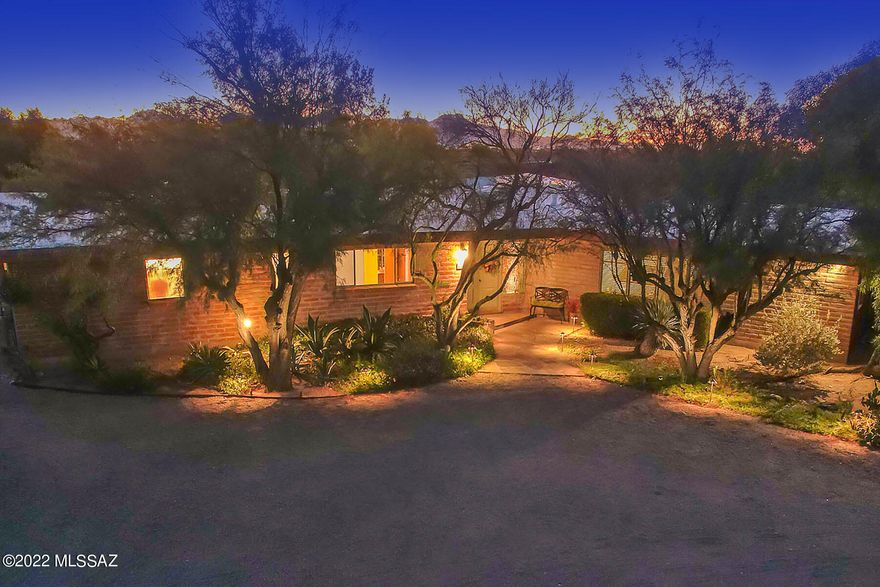 Located in the heart of the Catalina Foothills on spectacular elevated 1.63 acre site, overlooking the entire Tucson Valley. Whoever picked out this lot in 1959 had their choice of the best! Incredible views of surrounding mountains, city and  stunning sunsets! An inviting front entrance, this perfectly maintained and updated home with clean lines and lovely mature vegetation revealing views from every window! 
Granite island kitchen w/ bar seating, newer appliances, plenty of storage, opens up to living room as well as sliding door to covered patio and pool. Additional family room with views on both sides of the room and large wood burning fireplace.  Great for entertaining with multiple areas to enjoy and dine. Plenty of parking for all your guests! Catalina School district. Primary bedroom with thoughtfully placed windows to see the entire valley also opening up  patio and pool.  All new bathroom with large shower and bath. Great walk in closet.
Nice size guest rooms and  newly remodeled guest bathroom, both with views
Lovely new powder room, Nice size laundry room w/ storage and sink. 
Check out the garage and additional room with work bench, could serve as anything! 
Parking for 12 cars!