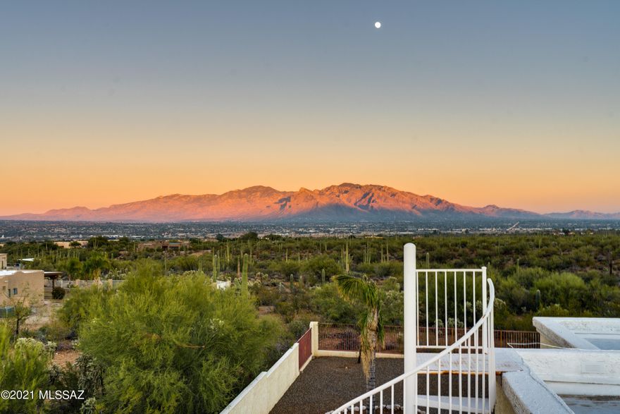 There are very few homes that have lots as amazing as this one! Unique opportunity to own 3.5 acres of land, with a  4/3 home  & stunning mountain views, 4 car garage, horse facilities all that borders the Saguaro National Park!  

With a little TLC this home will be restored to it's former glory!   A grand entrance thru the courtyard & foyer to the mouth dropping views thru the huge picturesque windows in the great room.   2 Master suites.  One with a jetted tub & walk in shower and the other with  a walk in tub! 
2- 2 car garages-cooled w/ evap coolers. #1 is extra long & WIDE- perfect for a workshop, utilitiy sink hook up,  & storage.  
Huge backyard w/ huge coverd patio, & Rooftop deck to enjoy the 360 degree views!  Barn with 4 stalls, paddock & riding arena. Nearby riding trails!