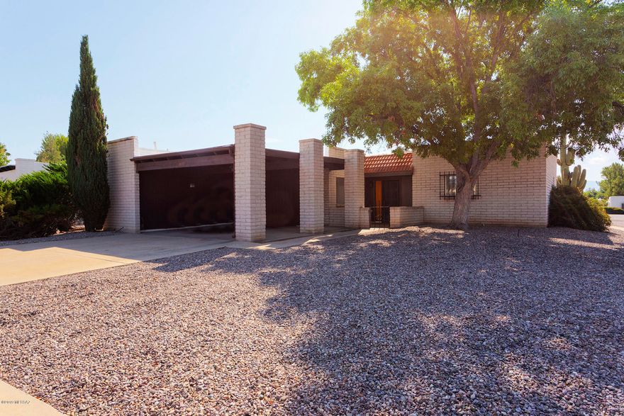MAJOR UTILITY UPGRADES!  Please see the sellers disclosures.  Now all that is needed is to add your own interior touches and enjoy the beautiful view.  This 1974 original owner home features 2 bedrooms, 2 bathrooms, a 2-car carport, and a dual-pane window-filled east-facing solarium with fireplace that frames the classic Santa Rita mountain view.  The corner lot is one block from the GVR Abrego South Pool and Recreation Center.  The Bryant HVAC was installed in 2008 as was the water heater.  Desert Meadows 2  Homeowners Association dues are currently $20/year.

Recent upgrades include new gas and electric service as well as new Square D electric panel.  Licensed Roof re-coat and 3-year warranty. Sewer scope in November, 2019 was clear.  Five original single-pane windows remain..