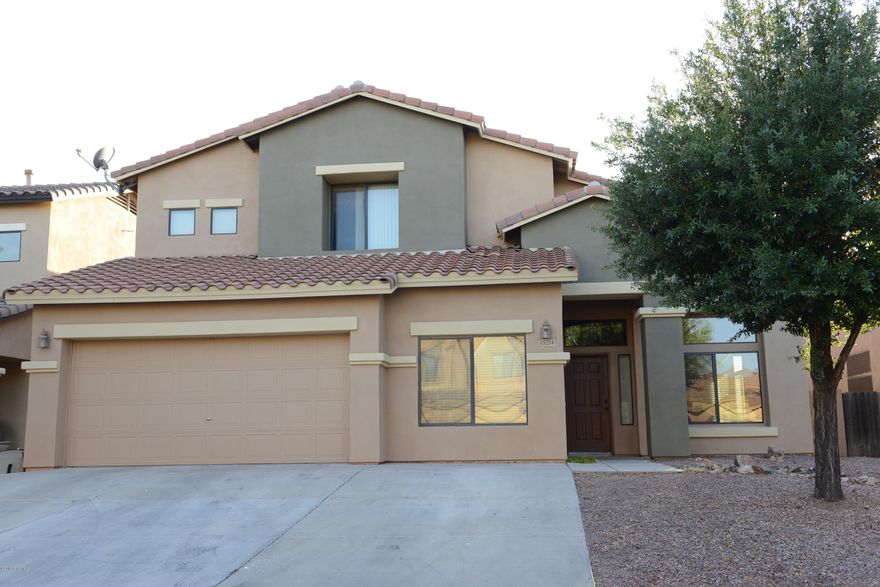 Spacious 5 bed, 3 full bath home in the desirable community of Rancho Sahuarita. First floor master suite. Brand new interior paint. New carpet in bedrooms. Huge beautiful kitchen with upgraded cabinets and large island with breakfast bar. Big upstairs loft. Cabinets and Storage in garage. Enjoy privacy in your new backyard with a tall rear wall, heated salt water Pebbled Tec pool and spa, and putting green! An entertainer's dream! Short walk to the clubhouse, schools and shopping. Come see this home today!
