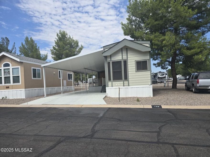 Tons of updates and upgrades in this adorable Park Model that boasts great kitchen with all appliances, including dishwasher, and custom-built wine cabinet.   Covered front porch, storage shed, on corner lot in RV Resort conveniently located close to Shopping, restaurants, medical services, and all other city amenities.  Park includes wide paved streets, wood shop, Library with computers, Wi-Fi, Heated Swimming pool, Spa, Fitness Center, Putting Green, Laundry, Observatory and much more! This is a lease hold Park Model. Buyer must apply to Butterfield RV Resort to rent lot. Rent varies per season, currently $395.83 per month.