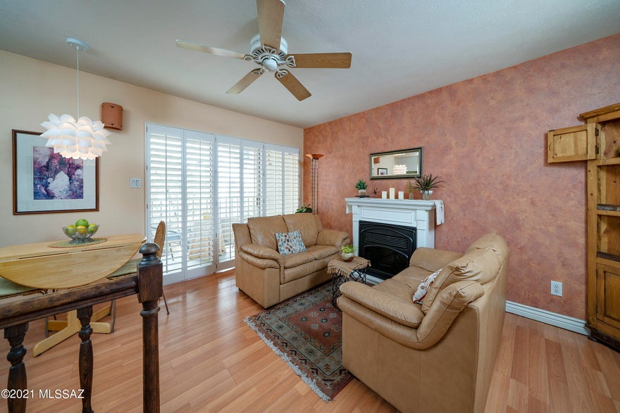 Adorable and charming 1 bed/1.5 bathroom unit in the conveniently located Las Colinas Condominiums. Enter the first level of this private and well-maintained unit to find a comfortable living room with electric fireplace, cozy dining area, updated laminate floors and a beautiful balcony overlooking common area. On the second level, the Master bedroom has a spacious walk-in closet and steps out onto a small, private patio; the master bathroom has a newly installed shower insert.  Attached carport with storage closet. HOA covers water, sewer and trash, community pool, and rec center. No rentals; must be owner occupied.