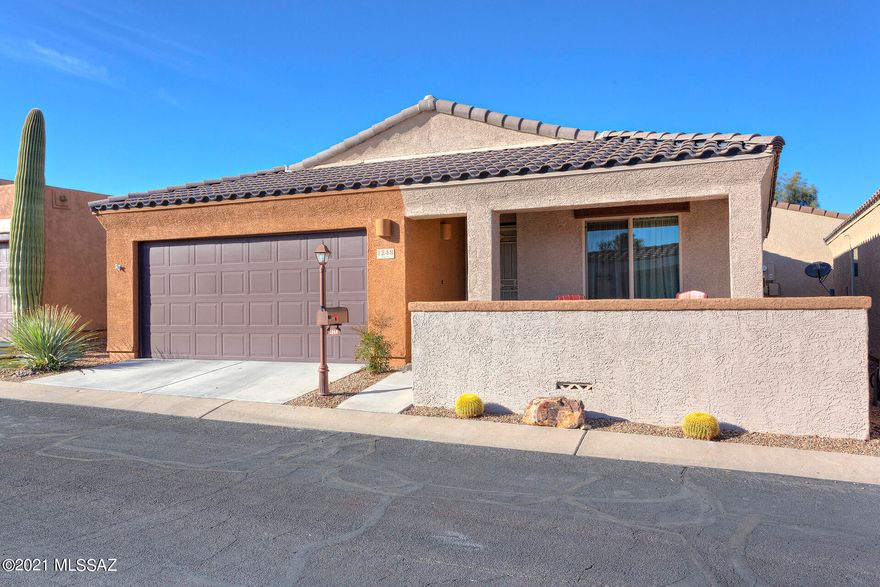 This fabulous home is in like-new condition and has all the right updates! Situated in the 55+ gated Rancho Resort community, this DR Horton home's features include a beautiful front courtyard and a 2 CAR GARAGE. Built in 2016 and updated with new flooring in 2019. Spacious kitchen with pantry closet, beautiful granite countertops and upgraded cabinets. Open living room and dining area. Bathroom features a large walk in shower and vanity with 2 sinks. Feels more spacious than the stated square footage. Enjoy some mountain views from the front courtyard. All appliances are included! Spacious laundry closet with shelf. No backyard, to maintain, leaving more time for you to play, relax and enjoy your sunny Arizona lifestyle! Community amenities are close by, including a gorgeous pool, clubhouse, pickle ball courts and much more! Easy access to shopping & I-19.